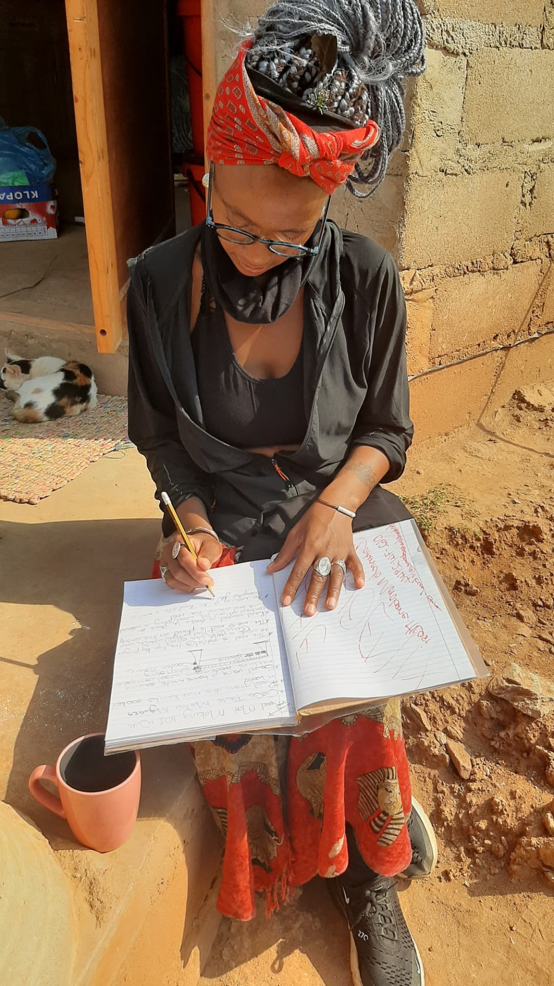 A participant journalling outdoors