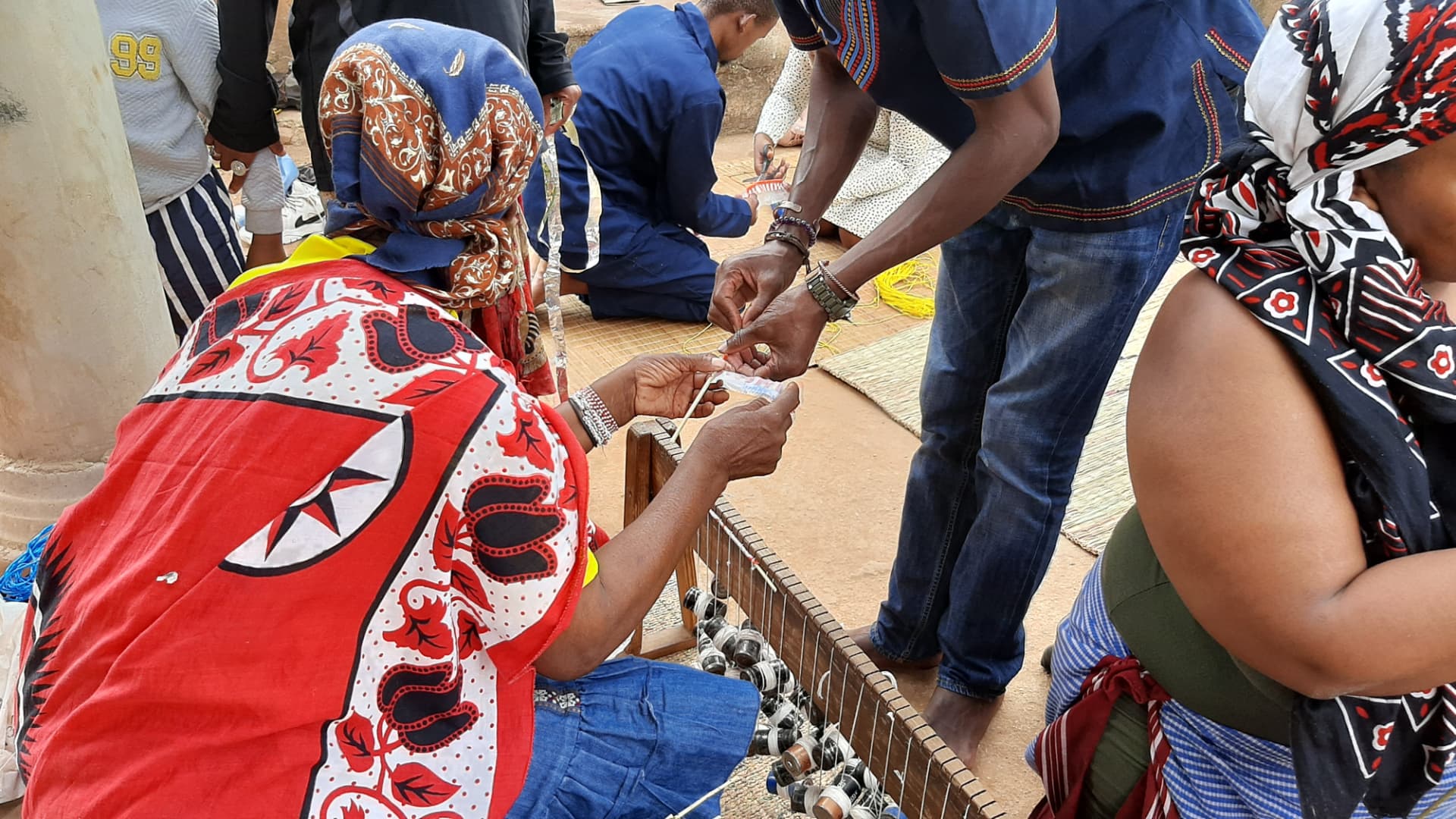 Participants weaving together outdoors during a uHambo journey